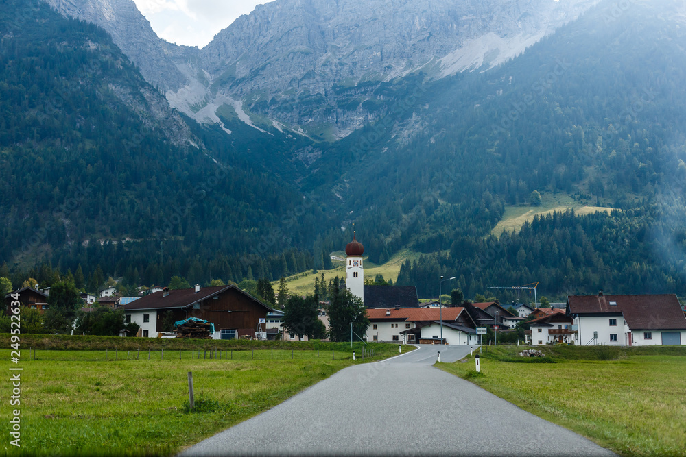 Obraz premium village road in the mountains, Alps