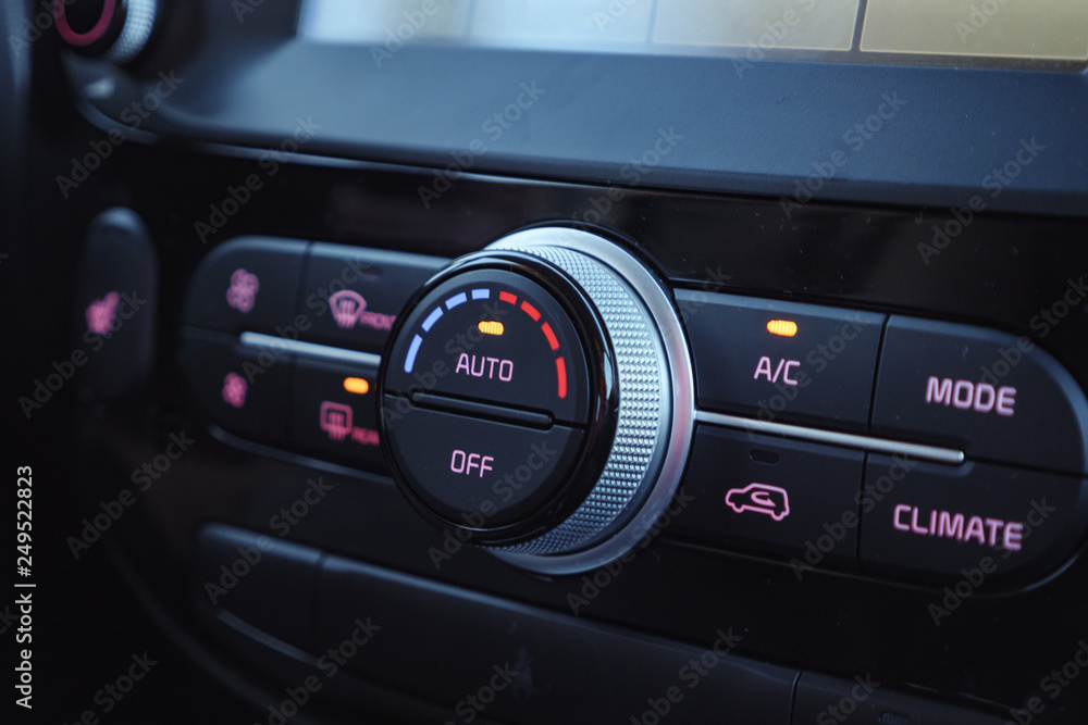 buttons of radio, dashboard, climate control in car close up buttons of radio, dashboard, climate control in car close up