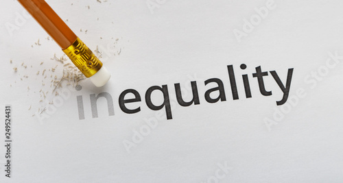 Erase part In in word Inequality on white background photo