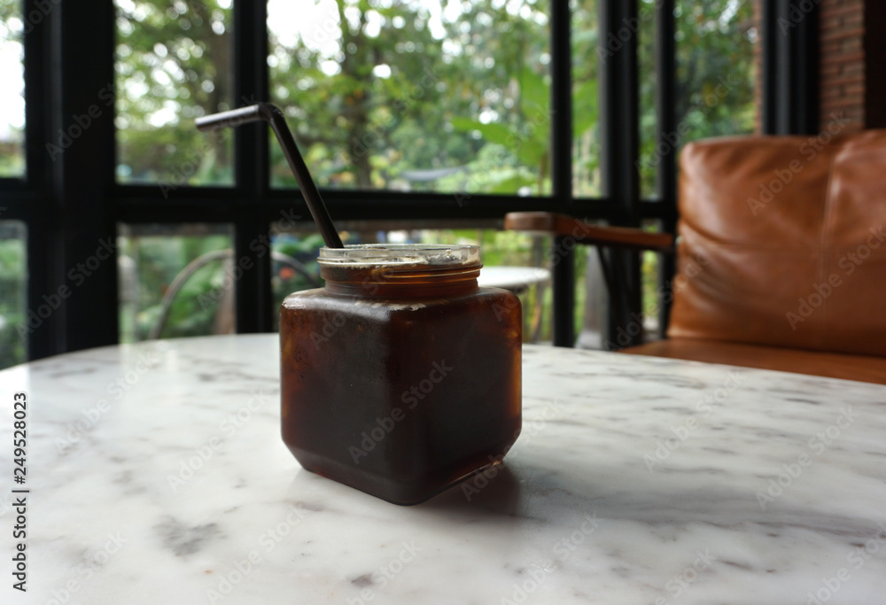 Iced coffee serving in glass mug Iced coffee serving in glass mug