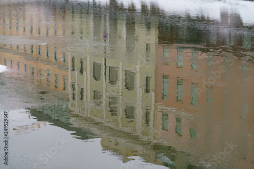 Photography The building is reflected in the frozen river