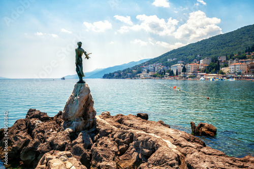 Fototapeta Naklejka Na Ścianę i Meble -  The historic statue of Maiden with the seagull is a symbol, not only of Opatija, but the entire Kvarner region. The statue on Adriatic coast is in the touristic town of Opatija in Croatia, Europe