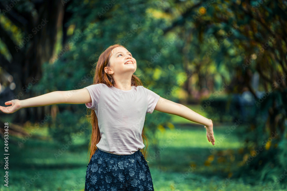 Happy cute little girl playing in the outdoor park in summer. Child ...