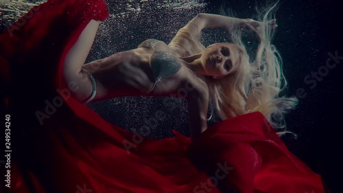 Charming mermaid shoot underwater.