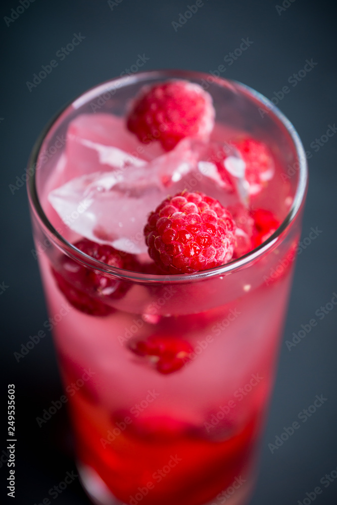 Sweet raspberry Tom collins cocktail. Selective focus. Shallow depth of field. Sweet raspberry Tom collins cocktail. Selective focus. Shallow depth of field.