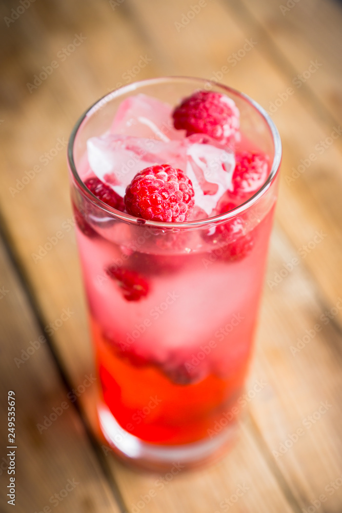 Sweet raspberry Tom collins cocktail. Selective focus. Shallow depth of field. Sweet raspberry Tom collins cocktail. Selective focus. Shallow depth of field.