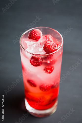 Sweet raspberry Tom collins cocktail. Selective focus. Shallow depth of field.