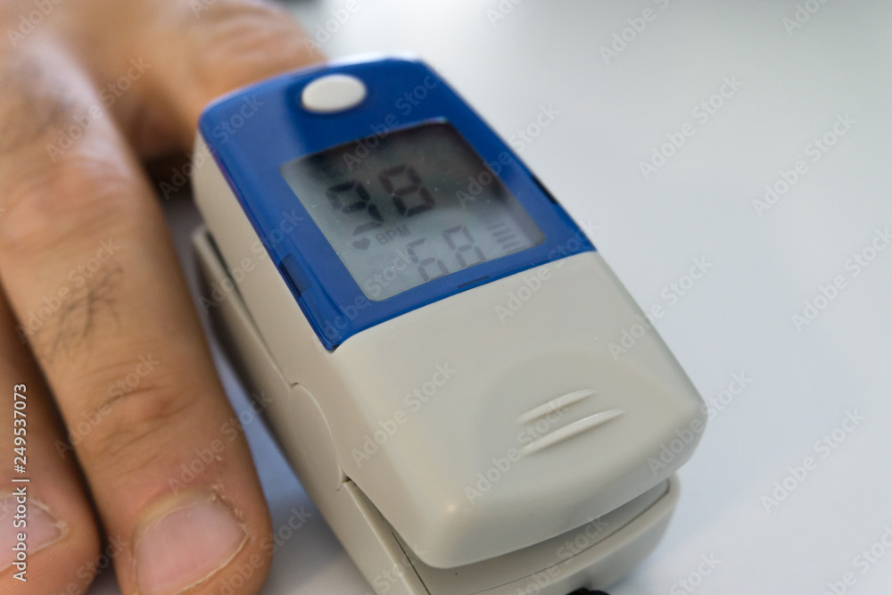 pulse oximeter with finger to measure saturation pulse oximeter with finger to measure saturation
