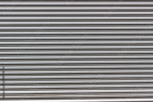 Wallpaper Mural Rolling steel door in gray color. Saara, Rio de Janeiro, Brazil. 2019 Torontodigital.ca