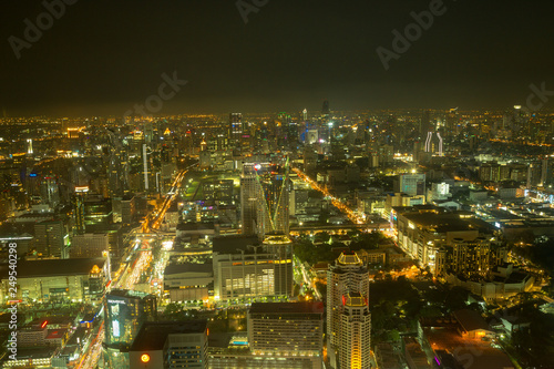 Aerial view of Bangkok skyline and skyscraper with light trails on Sathorn Road center of business in Bangkok downtown.