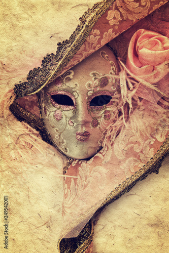 Close up of a pink woman venetian mask isolated on white background