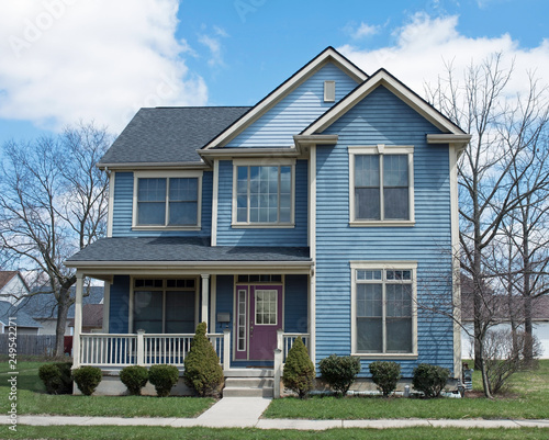 Photography Blue Two Story House with Purple Door