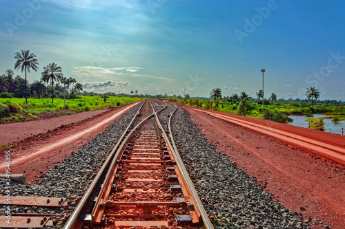 A newly laid section of rail track between Kamsar and Sangaredi in the west of the Guinea for the delivery of bauxite by train shuttle. photo