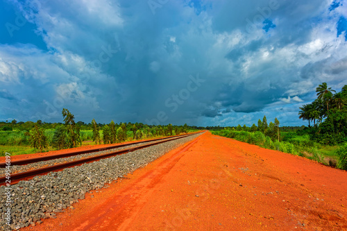 A newly laid section of rail track between Kamsar and Sangaredi in the west of the Guinea for the delivery of bauxite by train shuttle. photo