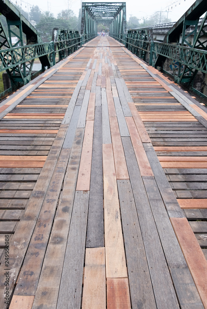 Old steel bridge with the wooden pathway. Old steel bridge with the wooden pathway.