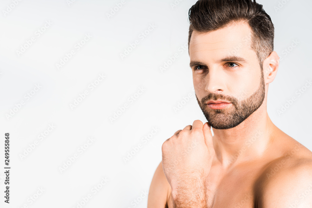 Naklejka premium handsome bearded man posing isolated on grey