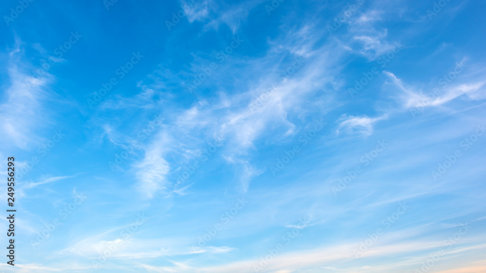 Clouds on a blue sky as background - obrazy, fototapety, plakaty 
