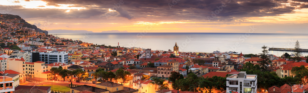 Beautiful panoramic cityscape of the skyline of the city Funchal on the island Madeira at sunrise in summer