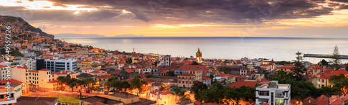 Beautiful panoramic cityscape of the skyline of the city Funchal on the island Madeira at sunrise in summer