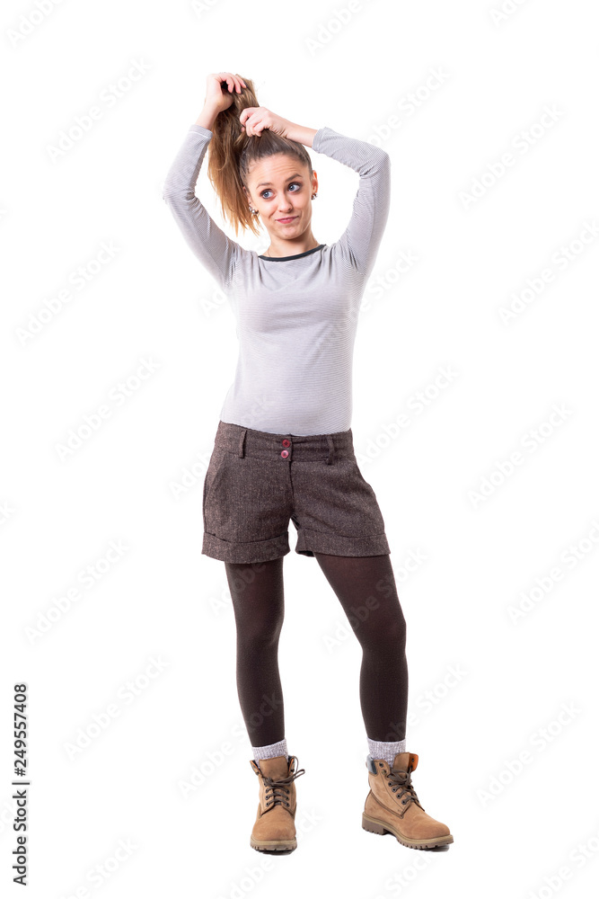 Funny expressive cute in retro styled clothes making hairdo herself. Full body isolated on white background. Funny expressive cute in retro styled clothes making hairdo herself. Full body isolated on white background.