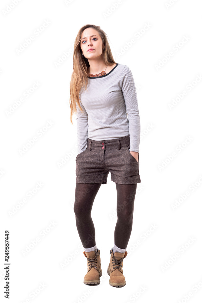 Cool funky stylish millennial hipster girl dancing slowly with hands in pockets. Full body isolated on white background. Cool funky stylish millennial hipster girl dancing slowly with hands in pockets. Full body isolated on white background.
