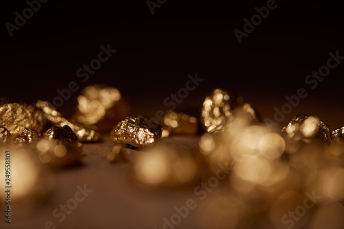 selective focus of golden stone on black background