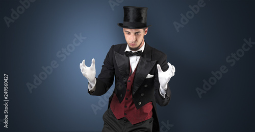Handsome magician with no graph holds something invisible