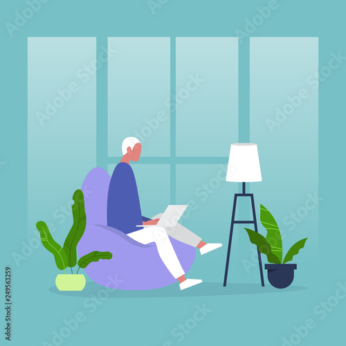 Young male manager sitting on the bean bag chair