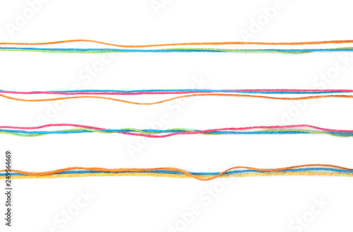 Set of colorful lines of cotton thread isolated on white background. Different color pink, green, yellow, blue orange thread mix.