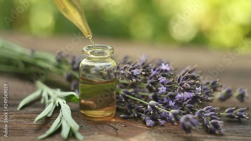 lavender essential oil in  beautiful bottle on table