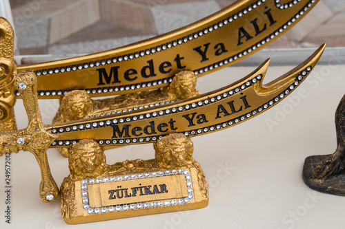 the legendary double edged sword of Imam Ali, It is a holy object among Shias and Alawites. Its Arabic name is Zulfiqar.