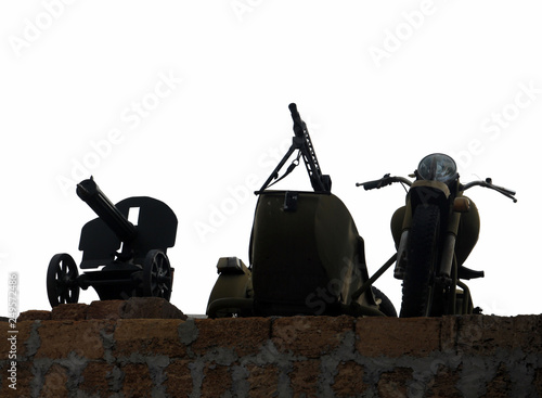 black silhouette of german motorcycle with sidecar and machine gun and Maxim machinegun isolated on white background photo