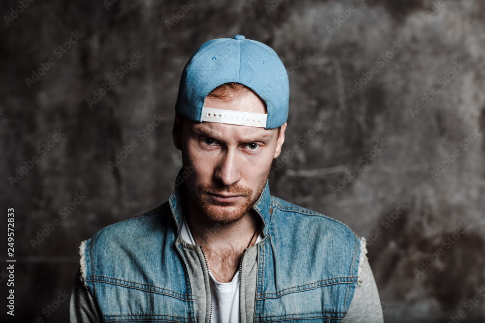 Male in a baseball cap and a denim jacket Male in a baseball cap and a denim jacket