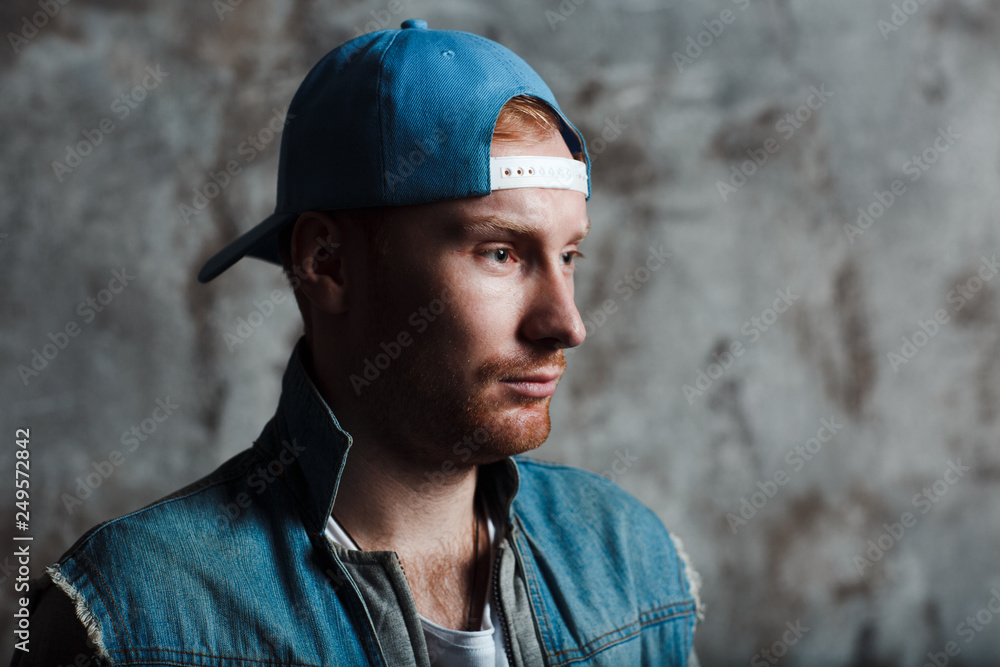 Male in a baseball cap and a denim jacket Male in a baseball cap and a denim jacket