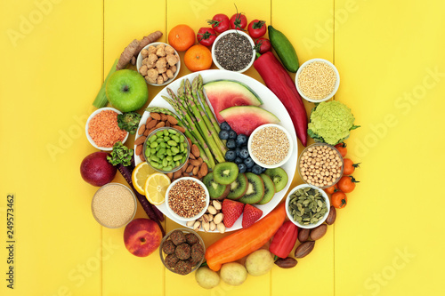 Fototapeta Naklejka Na Ścianę i Meble -  Vegan health food with fresh fruit and vegetables, grains, nuts, seeds, sos mix, quinoa balls, spice and legumes. Super foods high in antioxidants, protein, vitamins and dietary fibre.