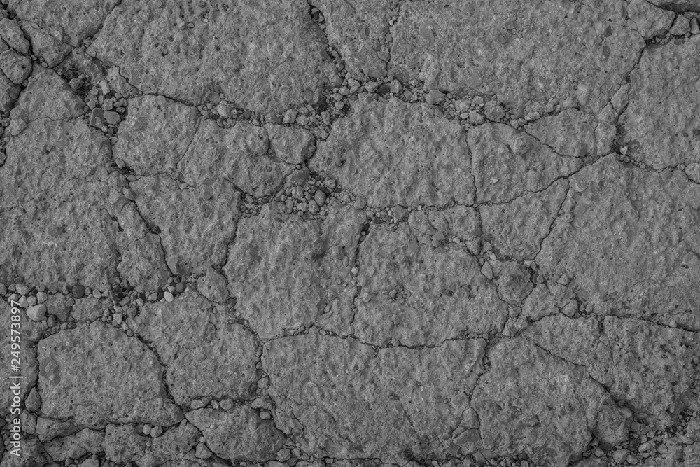 Gray textured concrete wall as an abstract background with cracks for poster, calendar, post, screensaver, wallpaper, postcard, card, banner, cover, website. A place for your design or text Gray textured concrete wall as an abstract background with cracks for poster, calendar, post, screensaver, wallpaper, postcard, card, banner, cover, website. A place for your design or text