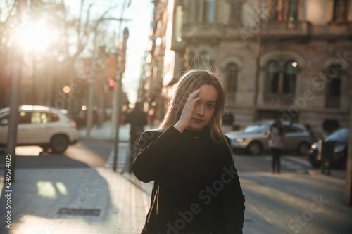 Casual portrait of blond girl at sunset in Barcelona