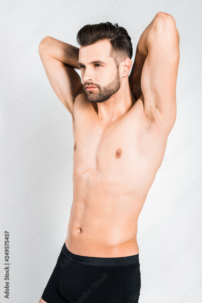 handsome bearded young man posing isolated on grey handsome bearded young man posing isolated on grey