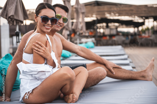 Pretty couple posing on the beach terrace and smiling © Yakobchuk Olena