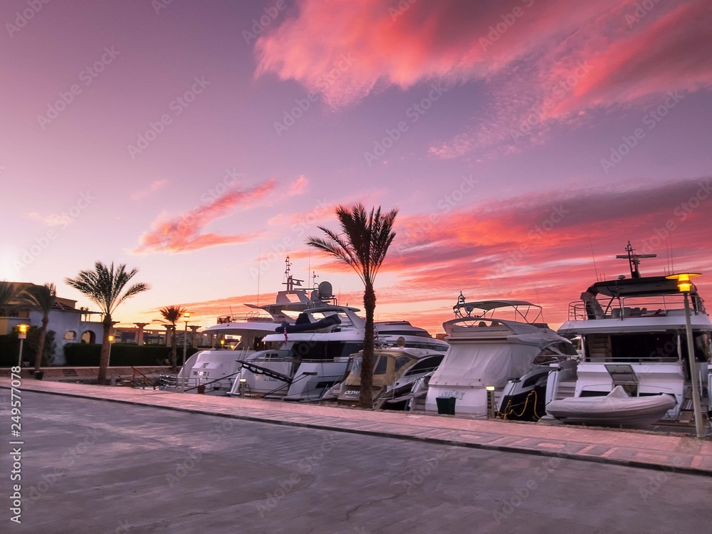Luxury yachts moored in Abu Tig Marina in El Gouna, Egypt at sunset