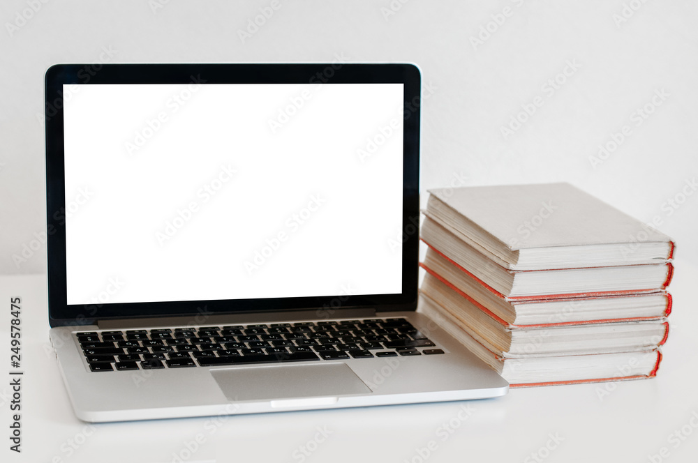 mockup laptop with blank screen with stack of books mockup laptop with blank screen with stack of books
