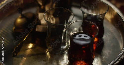 Steaming tea in oriental setting vibrating slightly