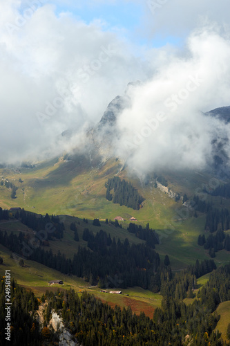 View of the mountain covered by the clouds. © thecolorpixels