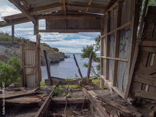 Shag Point. New Zealand. Coast. Old rusty boathouse photo