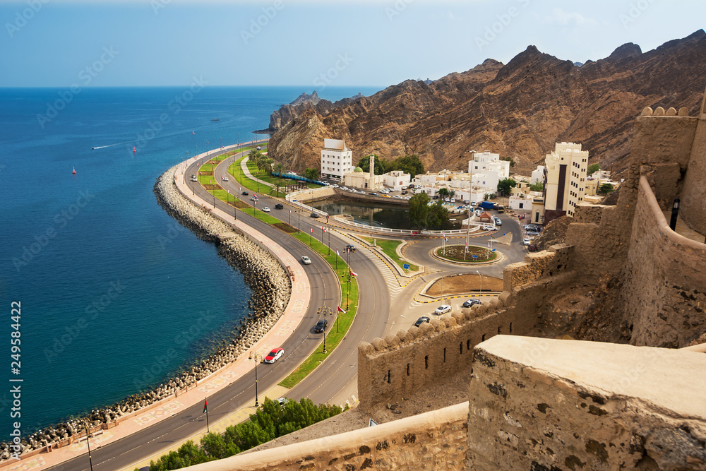 waterfront road under the Corniche of Mutrah in Muscat with cars