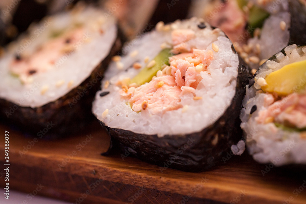 Banquet table with sushi on corporate christmas, birthday party or wedding celebration Banquet table with sushi on corporate christmas, birthday party or wedding celebration