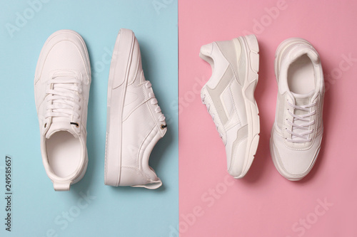 Wallpaper Mural  Men's and women's sneakers on a colored background top view. Sport shoes. White running shoes Torontodigital.ca