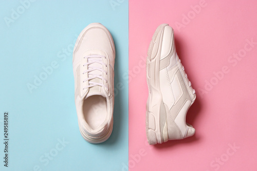women's sneakers on a colored background top view. Women's shoes.