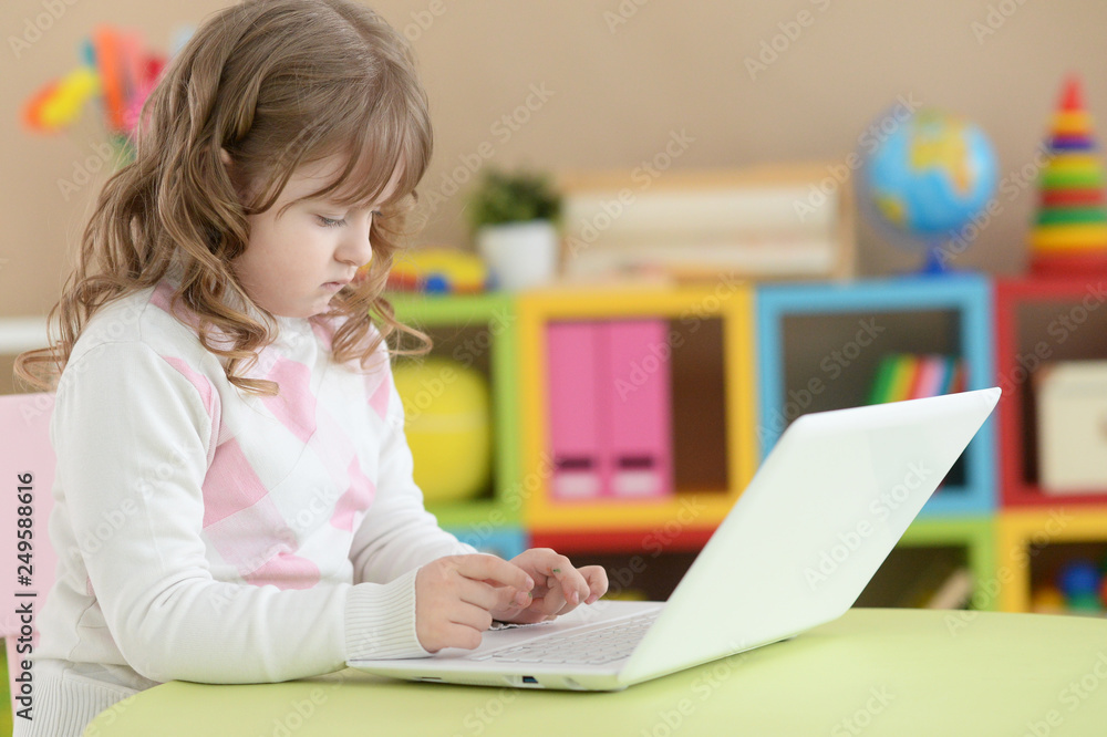 Portrait of a cute girl using laptop Portrait of a cute girl using laptop