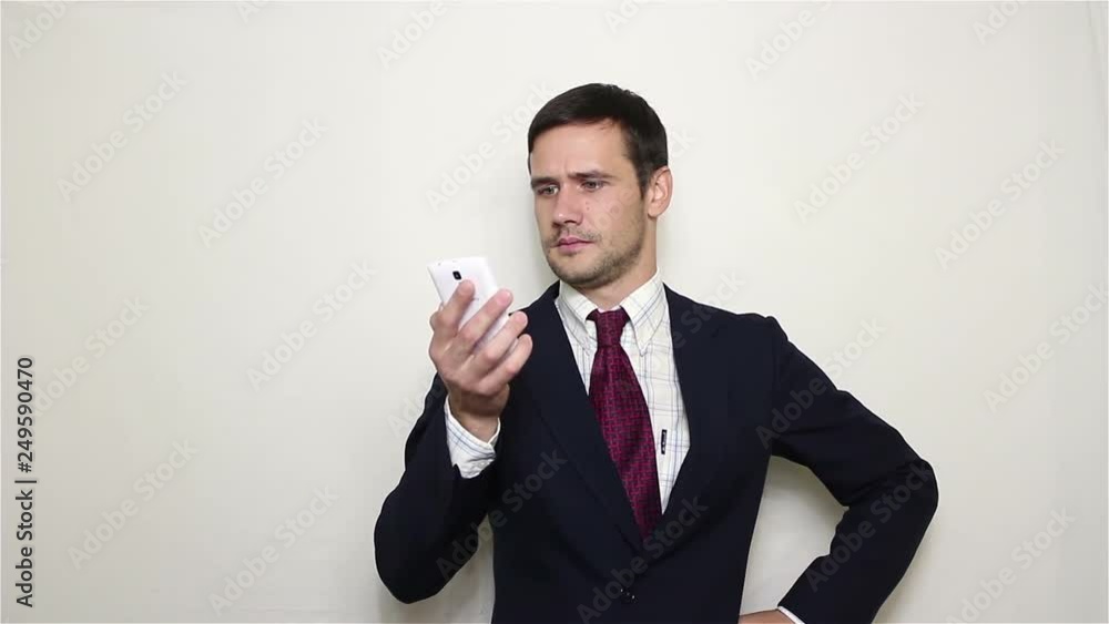 Young handsome businessman talking on the phone. Portrait on white background Young handsome businessman talking on the phone. Portrait on white background